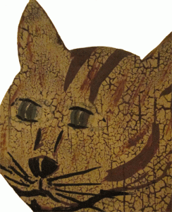 detail of wooden folk art cat