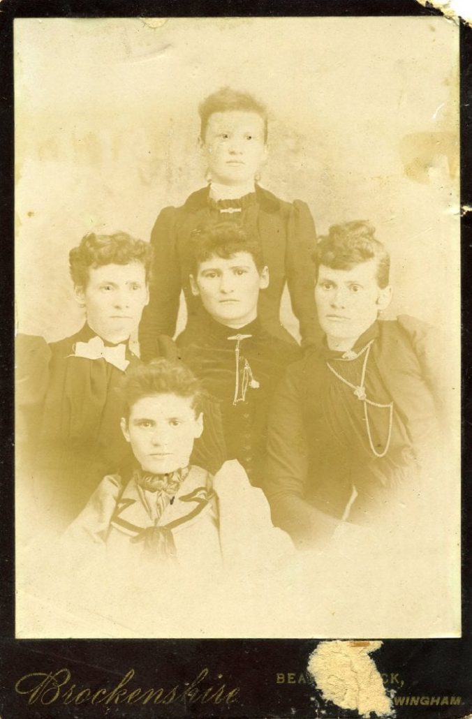 Photograph of five women circa 1890s. Photomark for Brockenshire, Wingham, at bottom.