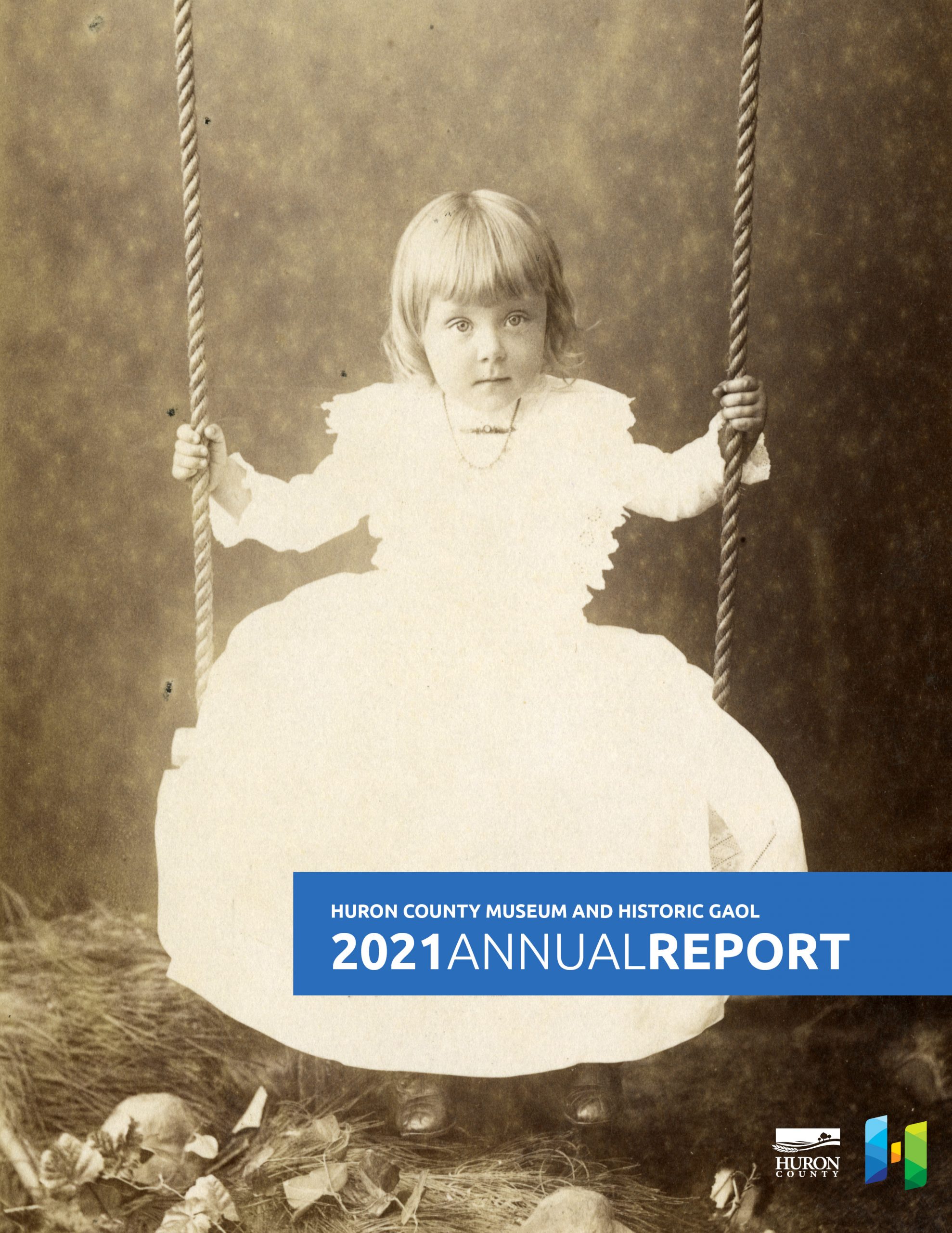Annual Report cover featuring historic photo of a little girl on a swing