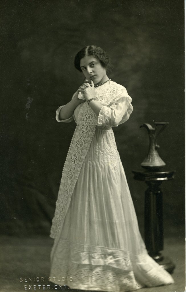 Historic image of a woman in a white dress