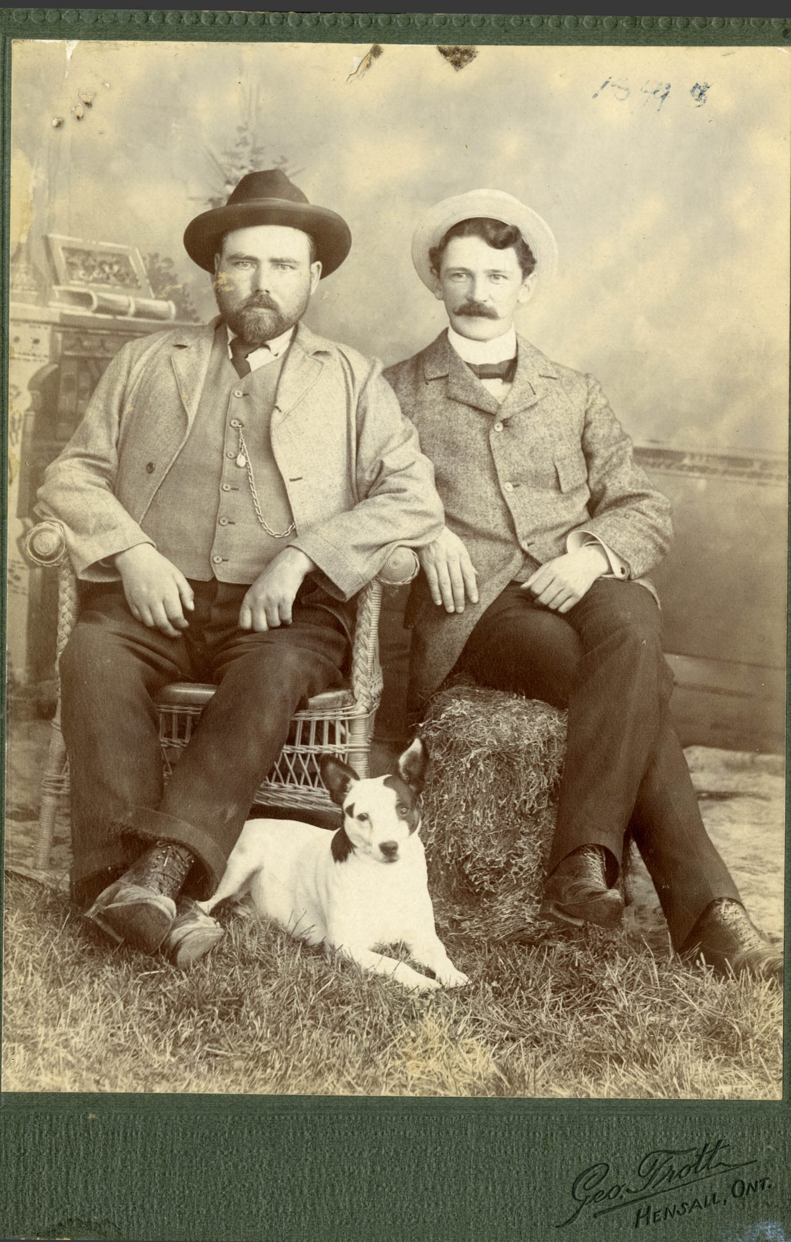Historic image of two men with a dog