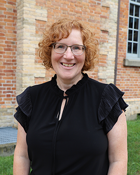 Photo of Elizabeth French-Gibson standing in front of the Huron County Museum