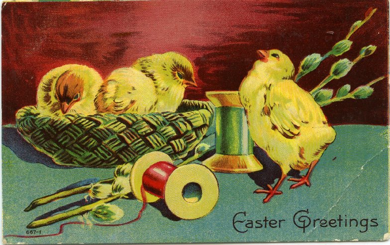 Ilustreated colour postcard. Two yellow chicks inside a basket on raised surface. Fourth chick standing beside them with spools of red and green ribbon and a pussy willow branch. Says "Easter Greetings."