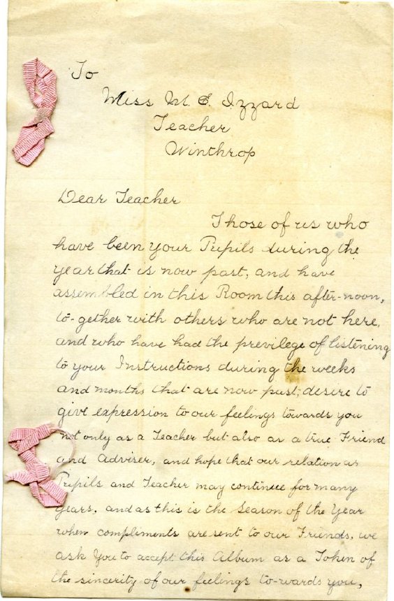 Handwritten letter on yellowed papers adorned with pink ribbons. 