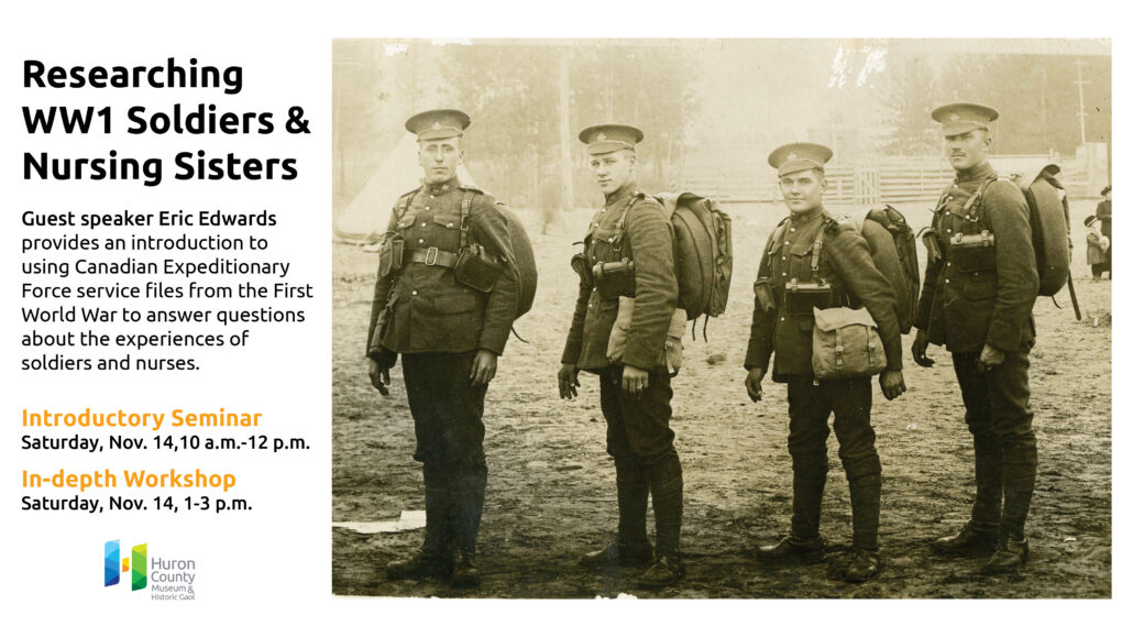 Black and white image of four smiling soldiers in uniform.